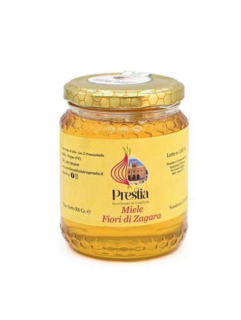 Vaso di miele di zagara con fiori di agrume